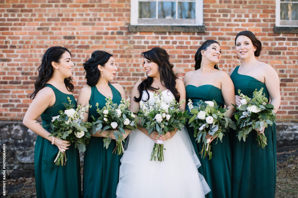 Stephanie and her bridesmaids pose for this sweet photo at a popular photo location close to the wedding venue.