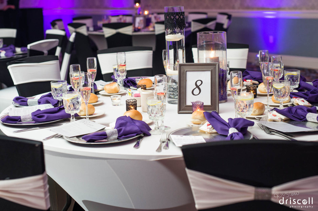 Metallic charger plates and colored napkins for a beautiful wedding set up at the Crystal Ballroom