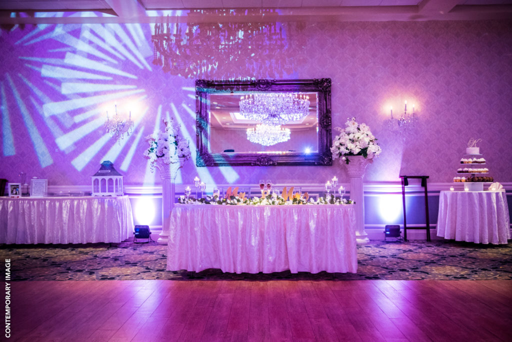 Lovely sweetheart table with some fun DJ lighting