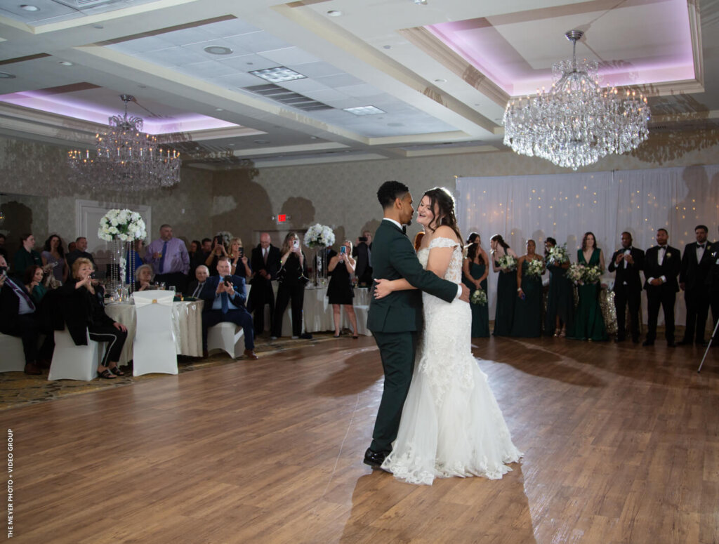 bride and groom's first dance in the crystal ballroom